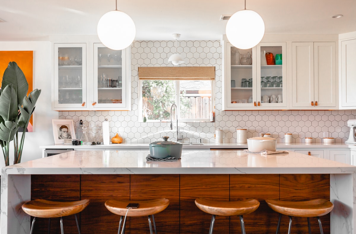 Bright designer kitchen with island seating